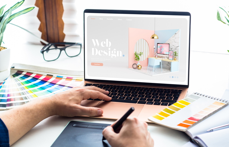Web design desktop with laptop and tools